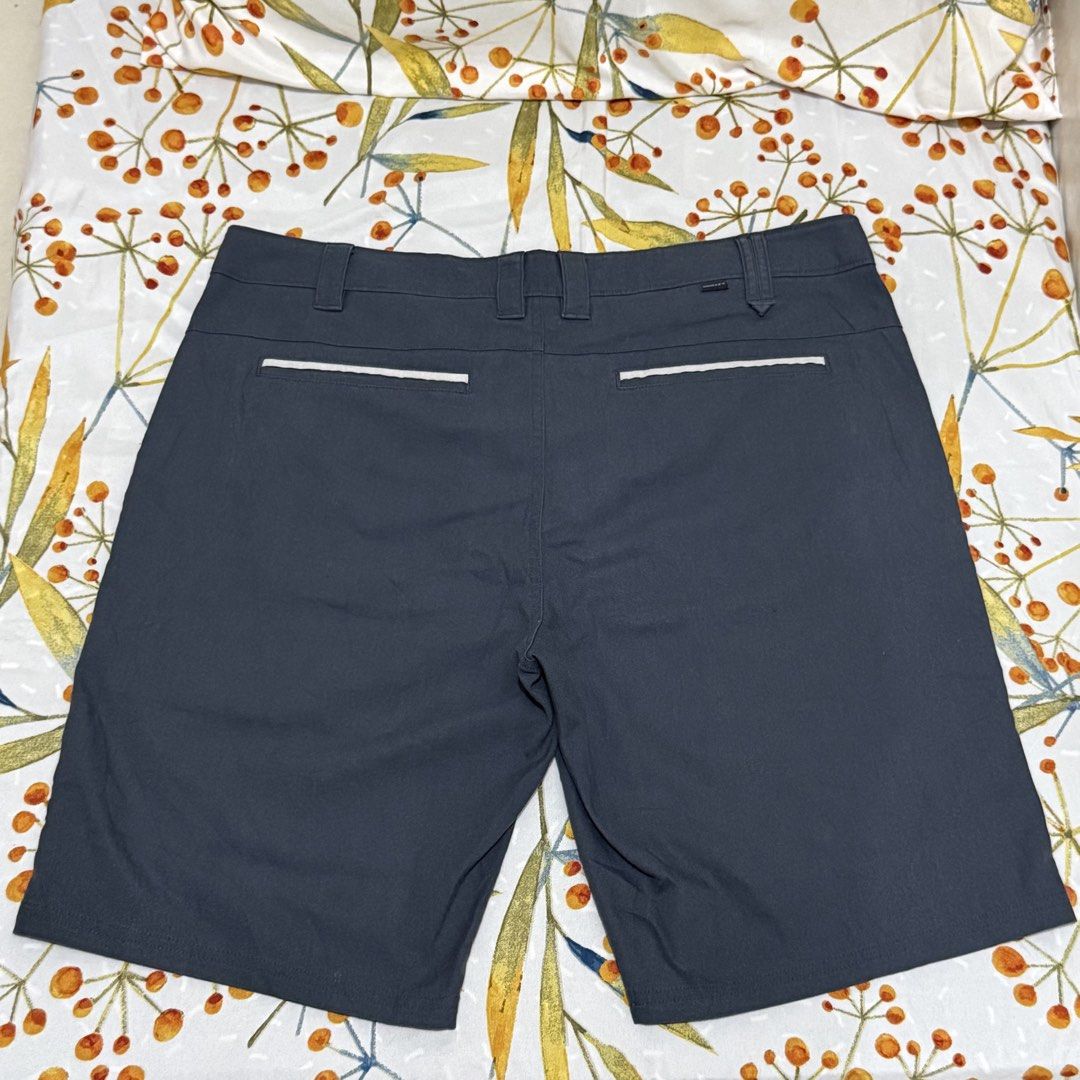 Oakley dark grey men's shorts size 36W (Category: Shorts) located in Manila. Submitted by coolphoenix.0 (Listing ID 1467721613, Image 2). Description: - Brand: Oakley - Color: Dark Grey - Size: 36W (Regular Fit) - Closure: Standard button closure with belt loops - Pockets: Two front pockets with contrasting trim, two back pockets with white piping and Oakley text tag - Branding: Subtle embroidered Oakley icon logo on the lower left leg - Conditio