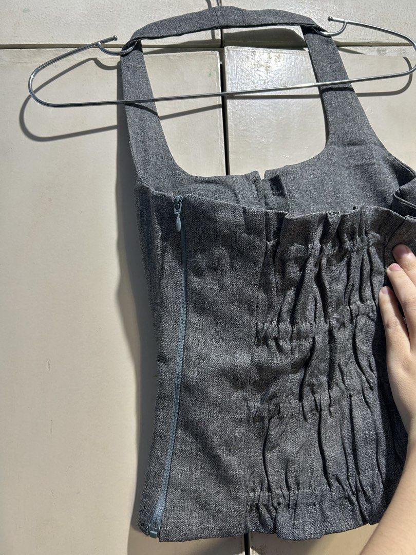 Ocha Wear Gray Halter Top Size S (Category: Sleeveless) located in Cavite. Submitted by michrolfe (Listing ID 1467685712, Image 3). Description: - Brand: Ocha Wear - Size: S - Color/Fabric: Gray with a textured heathered look - Design: Halter top with center split opening and 4 charming black ribbon accents - Fit & Closure: Full side zipper closure with an elasticated shirred back panel for extra stretch and comfort.