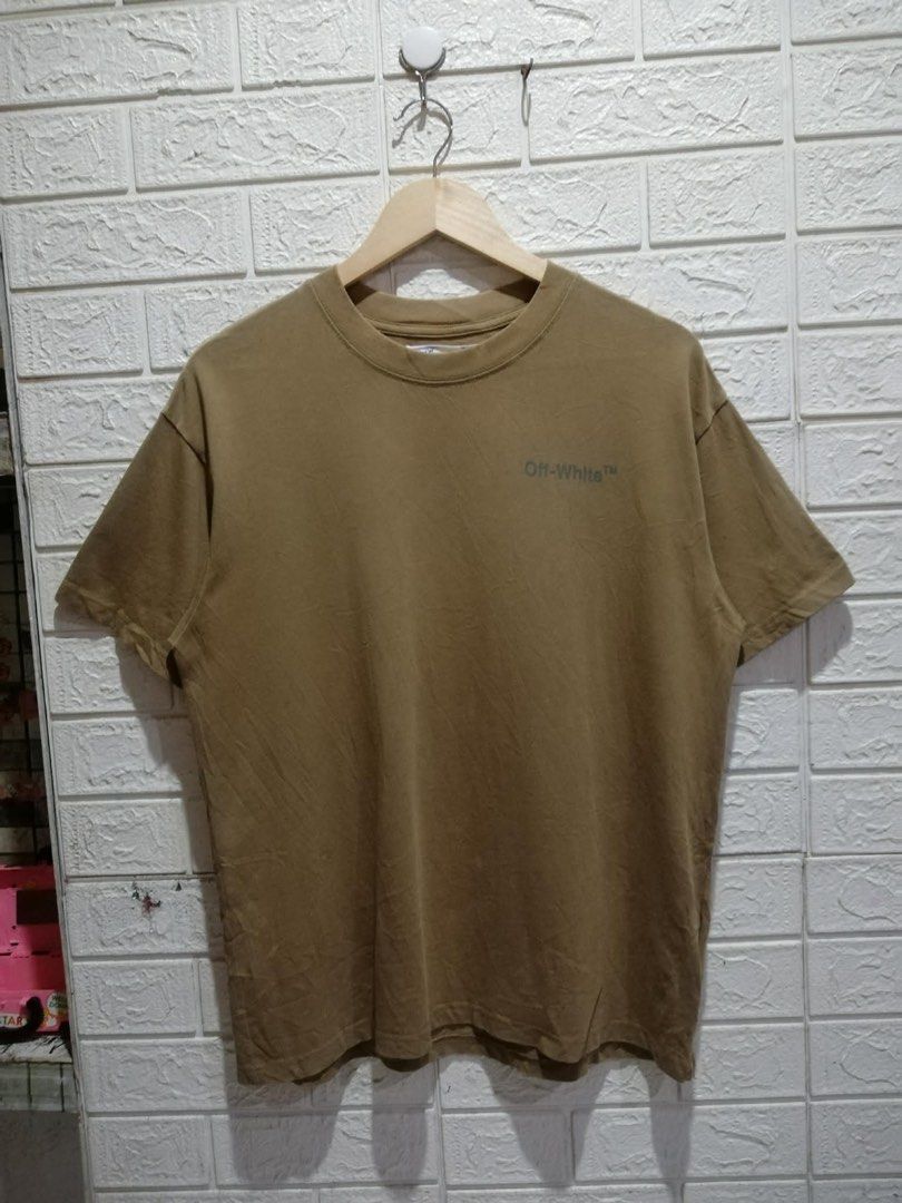 Off-White Brown Permanent T-Shirt Size S (Category: Tshirts & Polo Shirts ) located in Rizal. Submitted by tiangarcia02 (Listing ID 1467761367, Image 2). Description: - Brand: Off-White (Permanent Collection) - Color: Brown - Size: Small (S) - Material: 100% Cotton with rib collar - Fit: Standard crew neck, short sleeve - Design: Small chest logo text, large iconic diagonal stripes graphic on the back - Model Code: OMAA038S22JER002 - Condition: 1