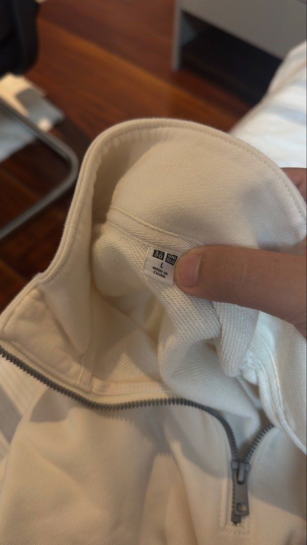 Off-white Uniqlo Quarter Zip (Category: Coats, Jackets and Outerwear) located in Manila. Submitted by royalgem-3655 (Listing ID 1467707957, Image 3). Description: - Brand: Uniqlo - Style: Quarter zip sweatshirt / mock neck - Color: Cream / off-white - Size: L - Material: Heavyweight cotton fleece - Condition: Clean, minimal casual wear - Features: Ribbed cuffs and hem, metal zipper pull, great layering piece.