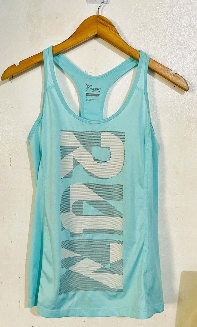 Old Navy Active Go-Dry Top (Category: Activewear) located in San Mateo. Submitted by safeearth21 (Listing ID 1467795103, Image 1). Description: - Brand/Style: Old Navy Active women's tank top - Size: Medium (semi-fitted) - Color: Light turquoise blue with large abstract front graphic - Material: Go-Dry moisture-wicking fabric to keep you cool - Features: Racerback cut and tagless inner collar - Condition: Excellent, clean with no stains or damage
