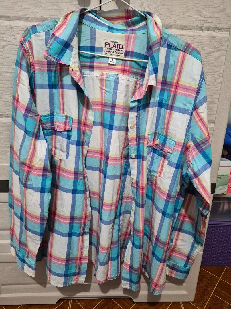 Old Navy Plaid Button-Down Shirt Size XL (Category: Shirts) located in Antipolo. Submitted by prinsesa_dianne (Listing ID 1467806891, Image 1). Description: - Brand: Old Navy - Style: Classic plaid button-down shirt with long sleeves and collar - Color: Multi-color (blue, pink, yellow, and white) - Size: XL - Features: Dual chest pockets, button-up front - Origin: Made in Indonesia - Condition: Great for everyday casual wear.