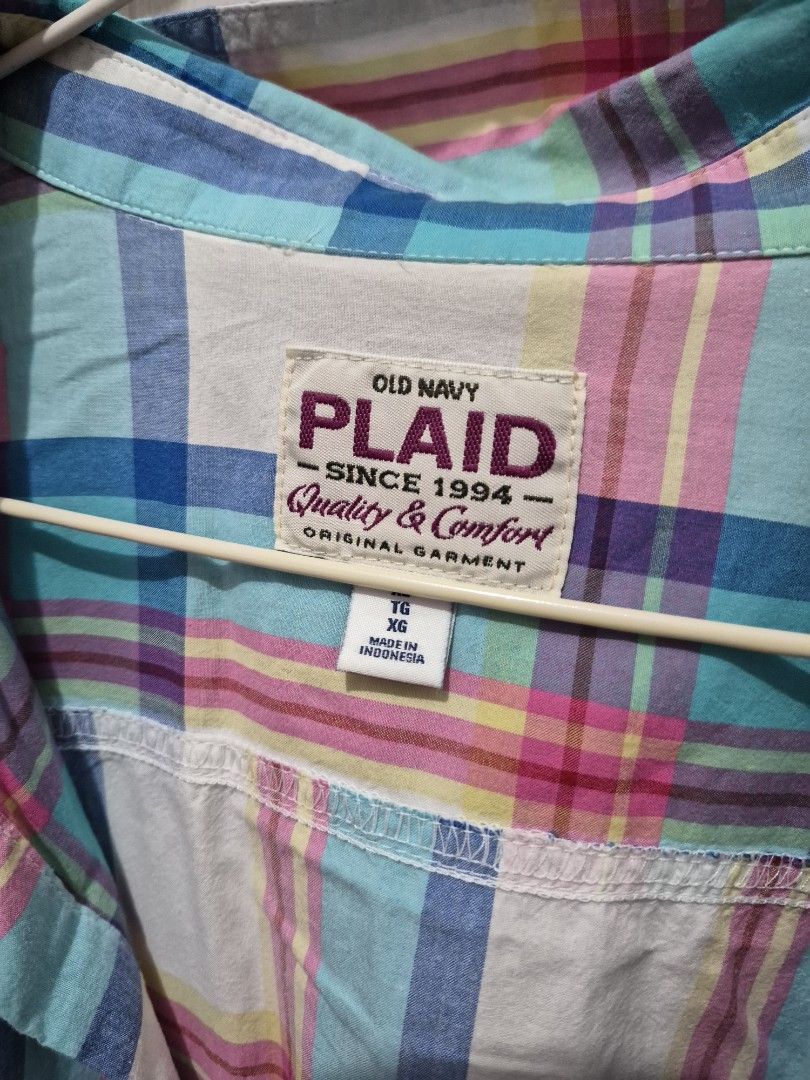 Old Navy Plaid Button-Down Shirt Size XL (Category: Shirts) located in Antipolo. Submitted by prinsesa_dianne (Listing ID 1467806891, Image 2). Description: - Brand: Old Navy - Style: Classic plaid button-down shirt with long sleeves and collar - Color: Multi-color (blue, pink, yellow, and white) - Size: XL - Features: Dual chest pockets, button-up front - Origin: Made in Indonesia - Condition: Great for everyday casual wear.