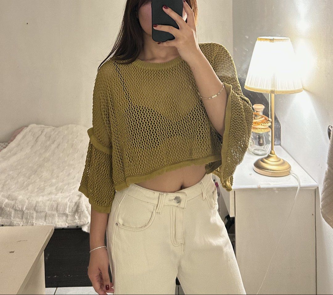 Olive green knitted open-work crop sweater with flared sleeves (Category: Coats, Jackets and Outerwear) located in Quezon City. Submitted by bae.randa (Listing ID 1467629806, Image 1). Description: - Color: Olive green - Style: Knitted crop sweater with an open mesh design - Features: Half sleeves, tiered flare details, and a round neckline - Fit: Loose, boxy fit -weighted knit, great great quality!!.