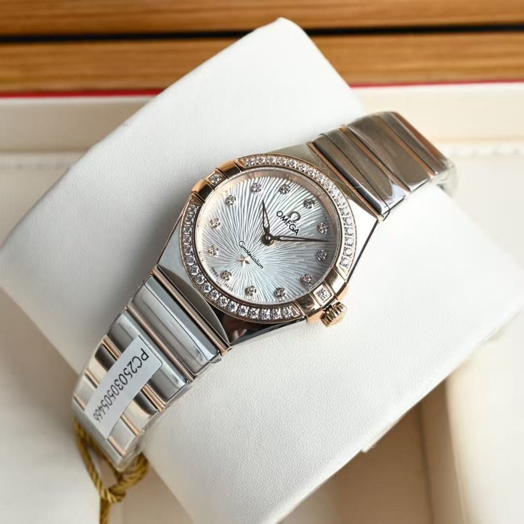 OMEGA Constellation Diamond Bezel Two-Tone Watch (Category: Luxury Watches) located in Cavite. Submitted by epicfish.4203a5 (Listing ID 1467688918, Image 3). Description: - Brand: OMEGA Constellation - Material: Two-tone stainless steel and rose gold - Dial: Textured white with signature star emblem at 6 o'clock - Details: Diamond-paved bezel and sparkling diamond hour markers - Inclusions: Original wooden presentation box with cream interior lin