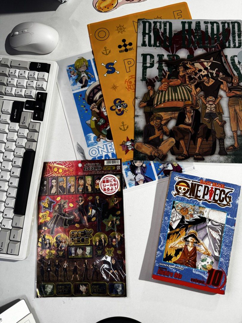 One Piece manga, folders, and sticker sheets bundle (Category: Stationery & School Supplies) located in Penaranda. Submitted by deardarlaph_ (Listing ID 1467706660, Image 1). Description: - One Piece Volume 10 manga - Includes character folders and metallic sticker sheets - Features Stampede movie and Red Hair Pirates artwork - Includes special Gold foil stickers.