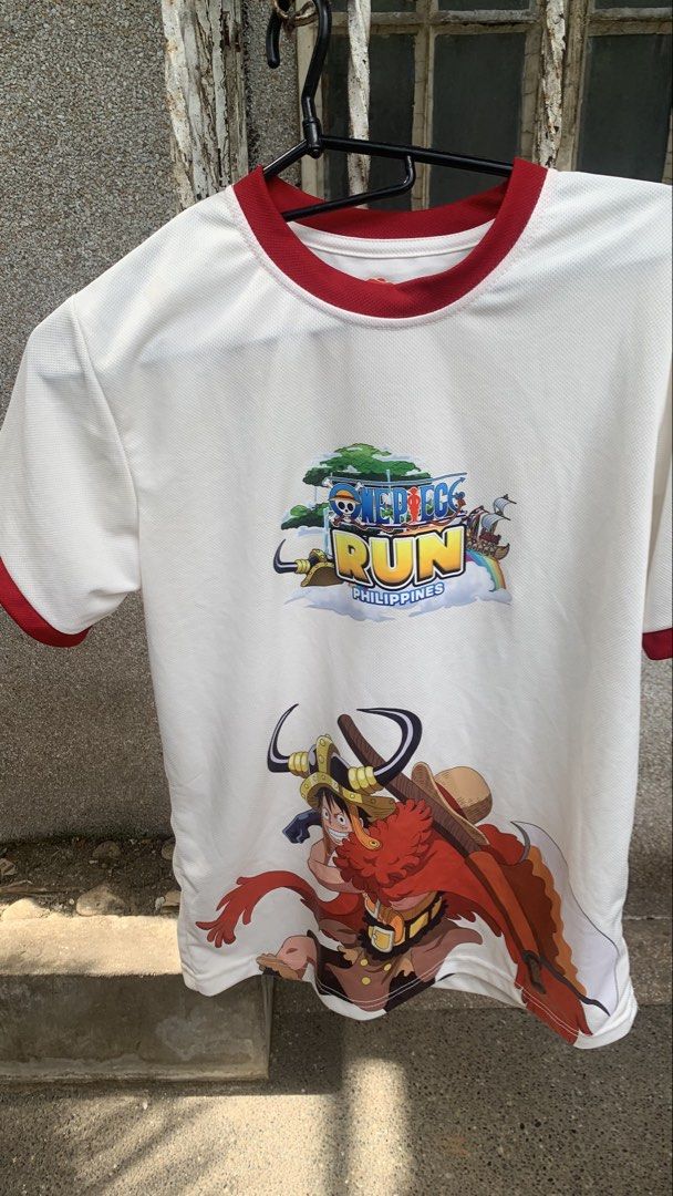 One Piece Run Philippines White Ringer T-Shirt (Category: Shirts) located in Caloocan City. Submitted by diannecarl32964 (Listing ID 1467619866, Image 1). Description: - Color: White with red trim on collar and sleeves - Design: Large One Piece Run Philippines & Luffy graphics on front, Straw Hat crew graphic on back - Material: Lightweight, breathable mesh-style fabric - Fit: Short sleeves, casual style - Condition: Brand new / Excellent quality