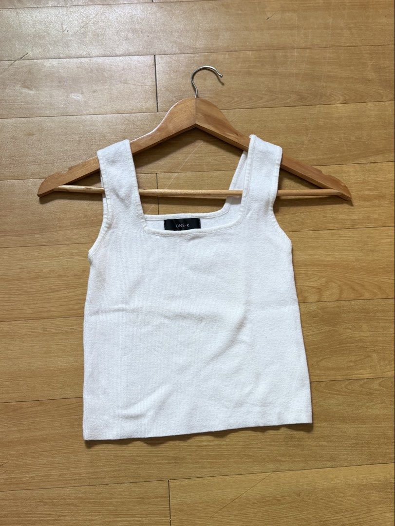 ONE-K White Square Neck Ribbed Tank Top (Category: Sleeveless) located in Las Pinas. Submitted by ann.co. (Listing ID 1467681893, Image 1). Description: - Brand: ONE-K - Color: Classic White - Style: Square neckline, sleeveless basic - Material: Soft and stretchable knit - Condition: Clean overall - Versatility: Great for layering or wearing on its own.