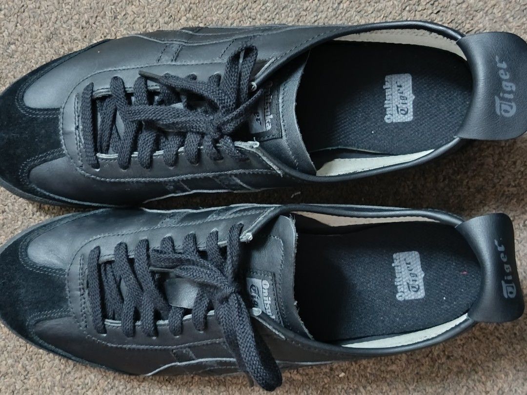 Onitsuka Tiger Black Sneakers D4J2L Size 46 (Category: Sneakers) located in Mandaluyong City. Submitted by andrew.18 (Listing ID 1467683729, Image 1). Description: - Brand: Onitsuka Tiger - Style/Model: D4J2L - Color: Classic Black Leather - Size: 29.0 cm / US 11.5 / EU 46 - Features: Standard lace-up front, textured rubber outsole for grip, clean insoles with clear branding - Origin: Made in Indonesia - Condition: Excellent, ready for everyday u