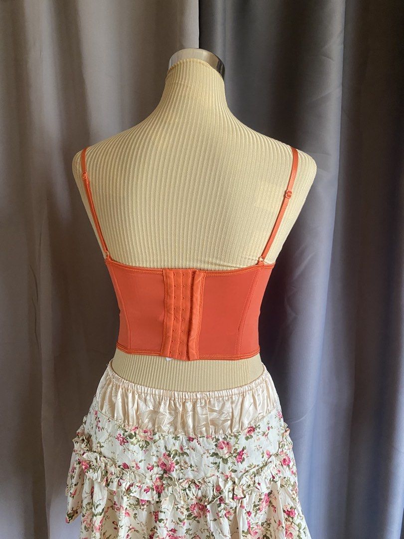 Orange Lace Mesh Corset Bustier Top (Category: Sleeveless) located in Cagayan de Oro. Submitted by curated_closetph (Listing ID 1467765073, Image 3). Description: — Size : XS - S — Color: Orange — Sheer mesh bodice overlay accented with romantic floral lace panels — Ruched and gathered underwire cups for beautiful shape and definition — Structured vertical boning throughout the front to cinch and define the waist — Curved dip-hem pointed baseline