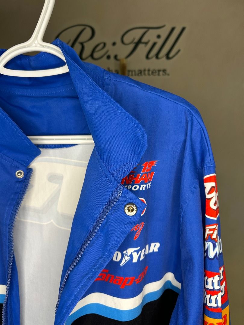OREO NASCAR Racing Promotional Jacket (Category: Coats, Jackets and Outerwear) located in Taguig. Submitted by re.wear.mnl (Listing ID 1467702080, Image 3). Description: - Bold blue racing jacket with eye-catching OREO logo across the front and back - Features iconic sponsor patches including Ritz, Post, Fig Newtons, Nutter Butter, and Chevrolet - Secure zip-up front closure with convenient snap buttons at the collar and hem - Stylish black and w