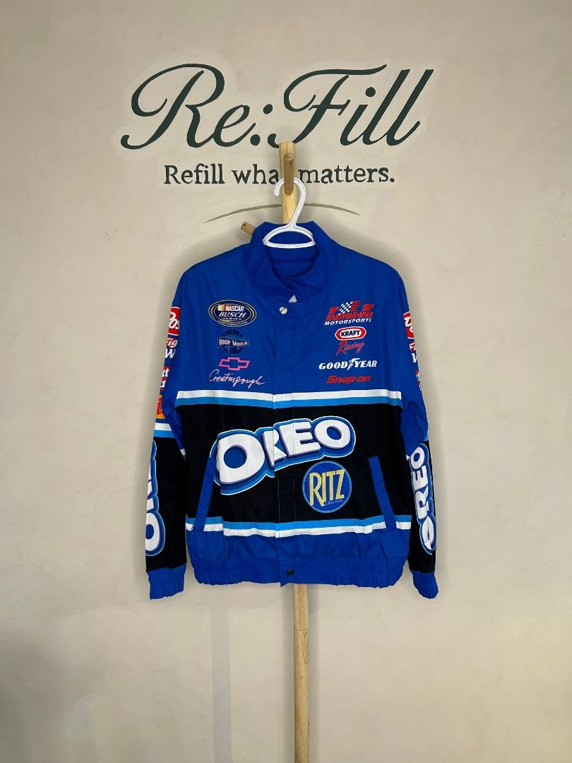 OREO NASCAR Racing Promotional Jacket (Category: Coats, Jackets and Outerwear) located in Taguig. Submitted by re.wear.mnl (Listing ID 1467702080, Image 1). Description: - Bold blue racing jacket with eye-catching OREO logo across the front and back - Features iconic sponsor patches including Ritz, Post, Fig Newtons, Nutter Butter, and Chevrolet - Secure zip-up front closure with convenient snap buttons at the collar and hem - Stylish black and w