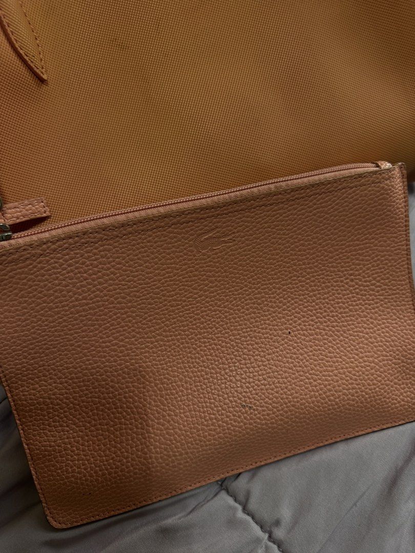 Original Lacoste Bag orange Leather (Category: Luxury Bags & Wallets) located in Cainta. Submitted by lexabeaonlineshoppe (Listing ID 1467617662, Image 3). Description: Pre-loved Selling my Original Lacoste Large Bag Orange Leather bag Large tote bag Marami pwede ilagay Nabili ko sa Eastwood libis Mall Original price-7999 Selling for 4500 only.