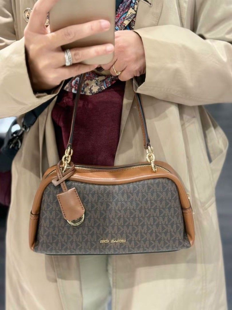 Original MK Cecily Small Shoulder Bag in Brown (Category: Luxury Bags & Wallets) located in Manila. Submitted by msddirectfactoryoutlet (Listing ID 1467730827, Image 3). Description: M* Cecily Small Shoulder Bag In Brown *Gold-tone hardware *10.75”(W) X 5.25”(H) X 4.5”(D) *Handle drop: 10.5″ *Exterior details: detachable strap *Interior details: back slip pocket *Lining: 100% polyester *Zip fastening Brandnew with tag and cc Onhand Pinas.