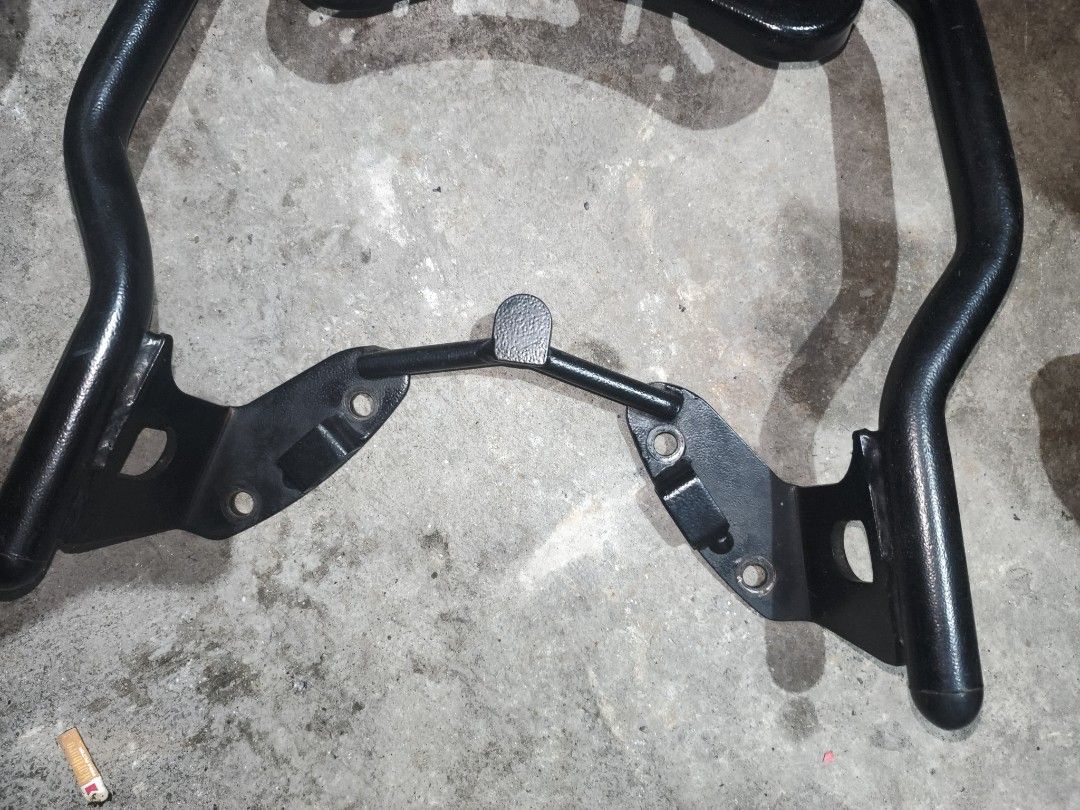 Ounwei Motorcycle Rear Cargo Rack Top Box Mount (Category: Body Parts and Accessories) located in Manila. Submitted by sofreezingbot (Listing ID 1467735506, Image 3). Description: Nmax v2 Topbox bracket - Durable black metal motorcycle rear rack with Ounwei branding plate - Sturdy tubular steel frame built for heavy loads - Includes mounting brackets and pre-drilled bolt holes for easy installation - Perfect for mounting a top box or extra luggag