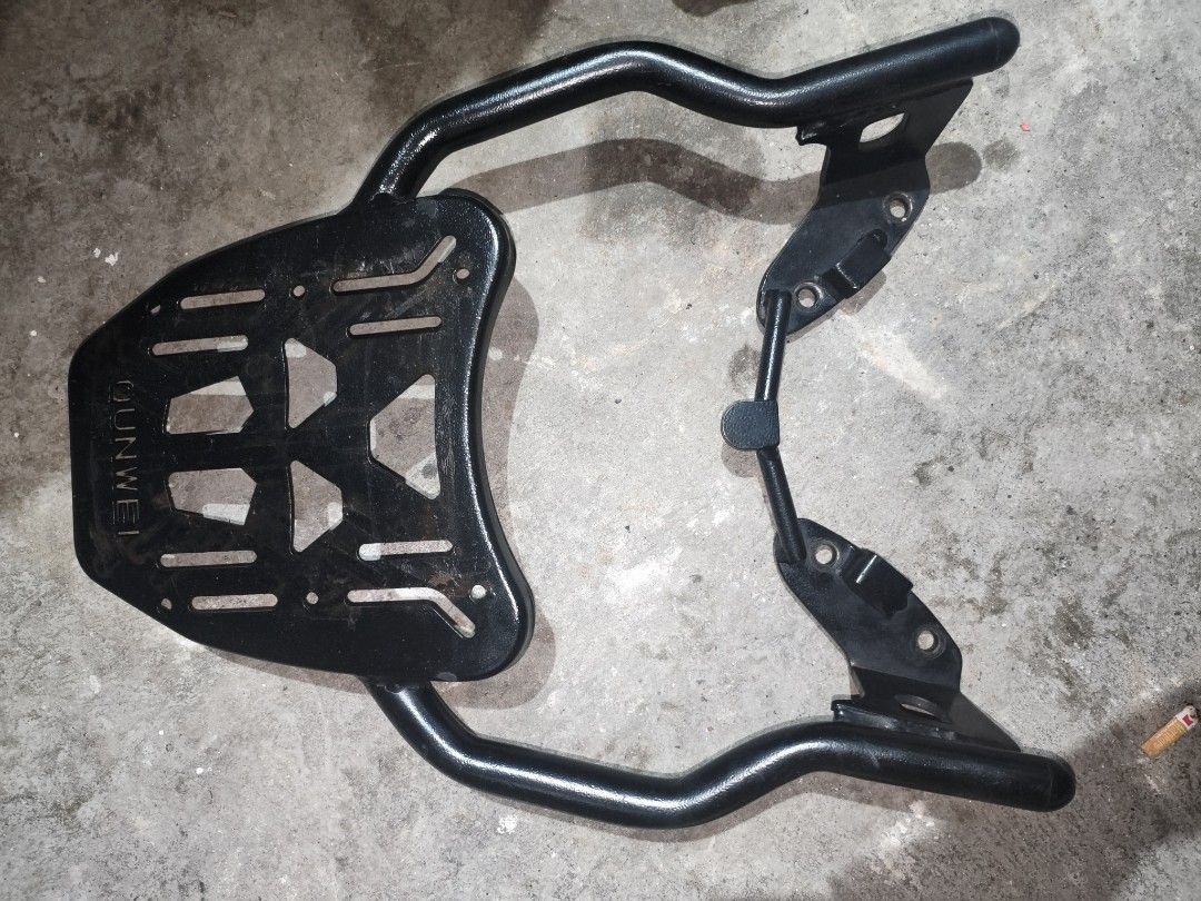 Ounwei Motorcycle Rear Cargo Rack Top Box Mount (Category: Body Parts and Accessories) located in Manila. Submitted by sofreezingbot (Listing ID 1467735506, Image 2). Description: Nmax v2 Topbox bracket - Durable black metal motorcycle rear rack with Ounwei branding plate - Sturdy tubular steel frame built for heavy loads - Includes mounting brackets and pre-drilled bolt holes for easy installation - Perfect for mounting a top box or extra luggag