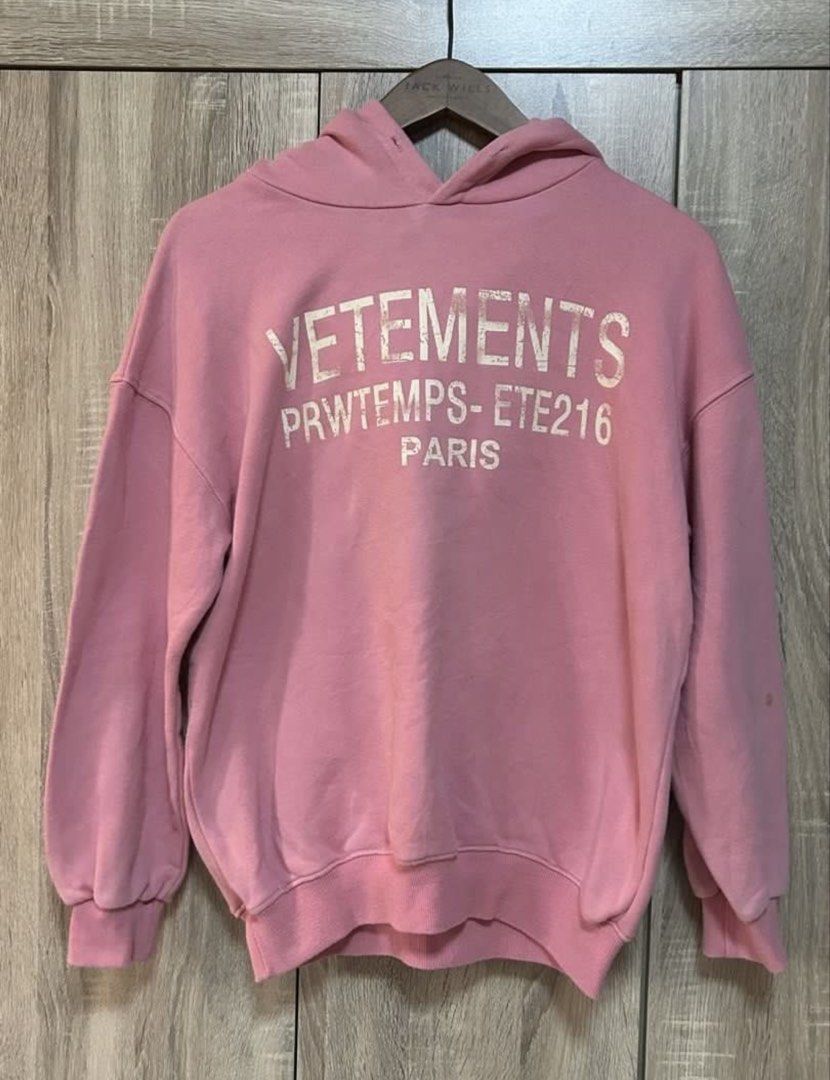 Oversized Pink Hoodie Jacket (Category: Coats, Jackets and Outerwear) located in Bulacan. Submitted by relove.re (Listing ID 1467747192, Image 1). Description: VETEMENTS Pink Hoodie 💗 Stylish pink pullover hoodie featuring a white VETEMENTS Paris graphic print. Designed with a hood, long sleeves, ribbed cuffs, and a relaxed fit for a trendy streetwear look. Perfect for casual wear and everyday OOTDs. Size S-M-L Petite ✨ Color: Pink ✨ Style: Pull
