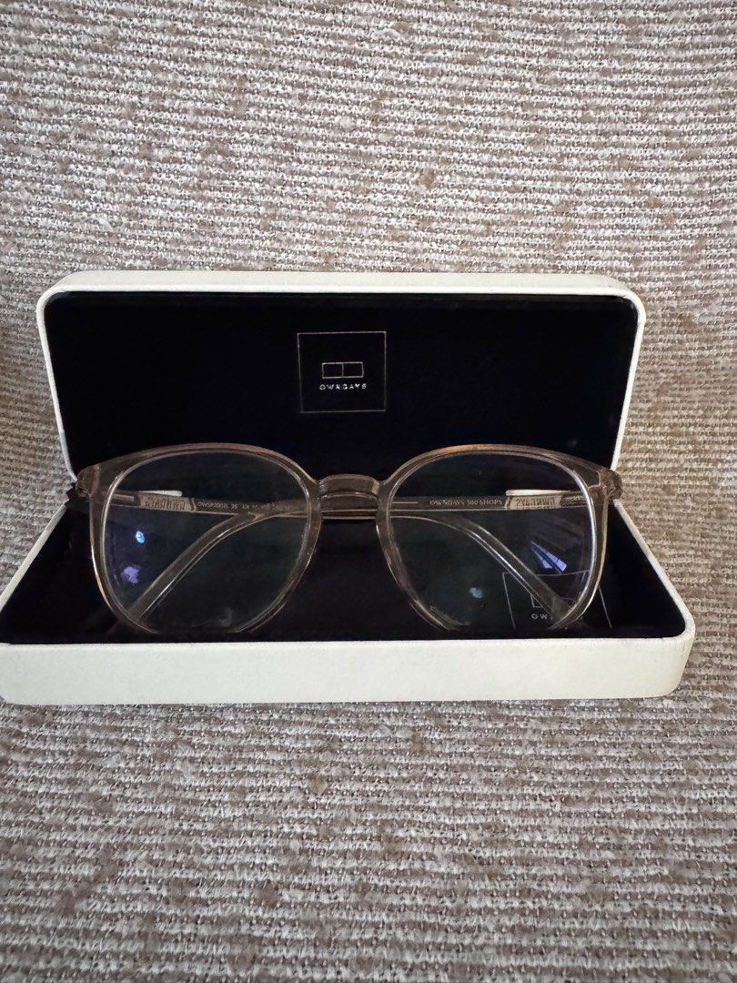 OWNDAYS Clear Pink Round Eyeglasses with Case (Category: Sunglasses & Eyewear) located in Marikina City. Submitted by switkimchi (Listing ID 1467632833, Image 1). Description: - Brand: OWNDAYS - Style: Classic round optical frames - Color: Translucent pinkish tone - Lenses: Clear (non-prescription/stock) - Material: Lightweight acetate with temple branding - Condition: Minimal wear overall - Inclusion: Original white hard case with black velvet i