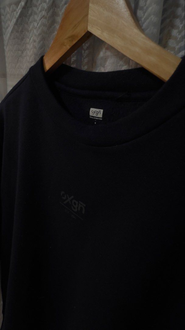 Oxgn Black Crewneck Sweatshirt Size S (Category: Coats, Jackets and Outerwear) located in Pasig City. Submitted by morilove (Listing ID 1467677570, Image 2). Description: - Brand: OXGN (Est. 1996) - Style: Classic crewneck pullover sweatshirt - Size: Small - Color: Solid Black - Details: Subtle dark grey chest print logo and 'For All Generations' collar tag - Features: Comfortable ribbed cuffs and hem - Condition: Excellent pre-loved/ready to wea
