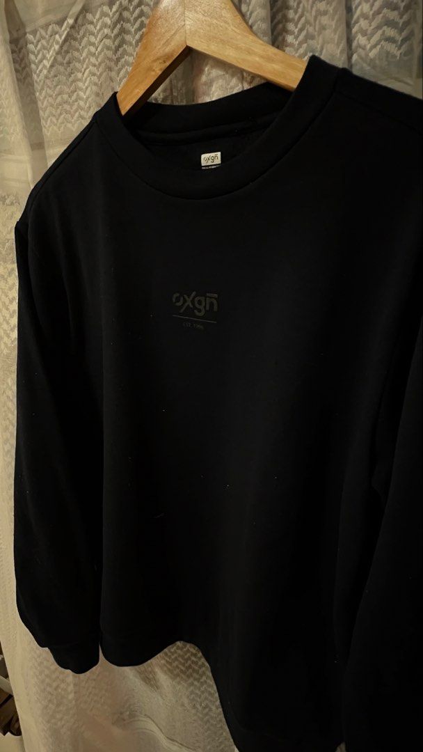 Oxgn Black Crewneck Sweatshirt Size S (Category: Coats, Jackets and Outerwear) located in Pasig City. Submitted by morilove (Listing ID 1467677570, Image 3). Description: - Brand: OXGN (Est. 1996) - Style: Classic crewneck pullover sweatshirt - Size: Small - Color: Solid Black - Details: Subtle dark grey chest print logo and 'For All Generations' collar tag - Features: Comfortable ribbed cuffs and hem - Condition: Excellent pre-loved/ready to wea