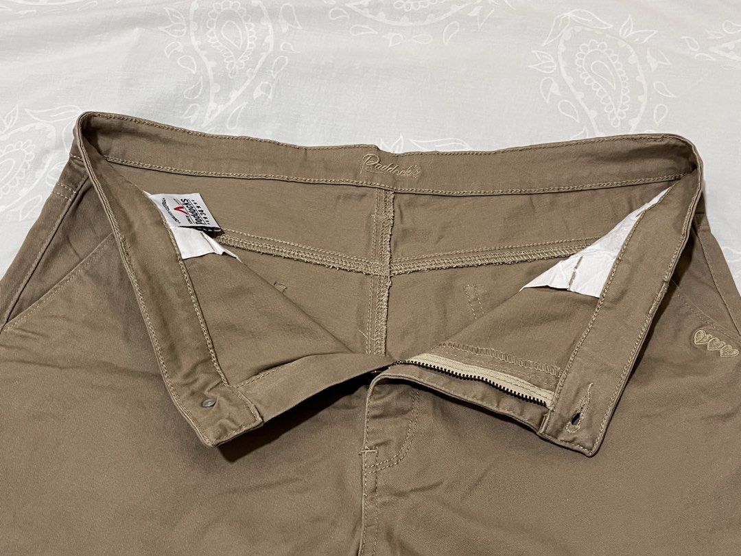 Paddock's Brown Casual Shorts Size 34 (Category: Shorts) located in Koronadal. Submitted by declutterprelovednitine_ey (Listing ID 1467627309, Image 3). Description: - Brand: Paddock's - Size: 34 - Color: Brown - Closure: Button and zipper fly - Design: Cuffed hem with subtle embroidered heart detail near the front left pocket - Pockets: Two front pockets and two back pockets with a branded metal tag - Condition/Quality: Clean stitching and durab