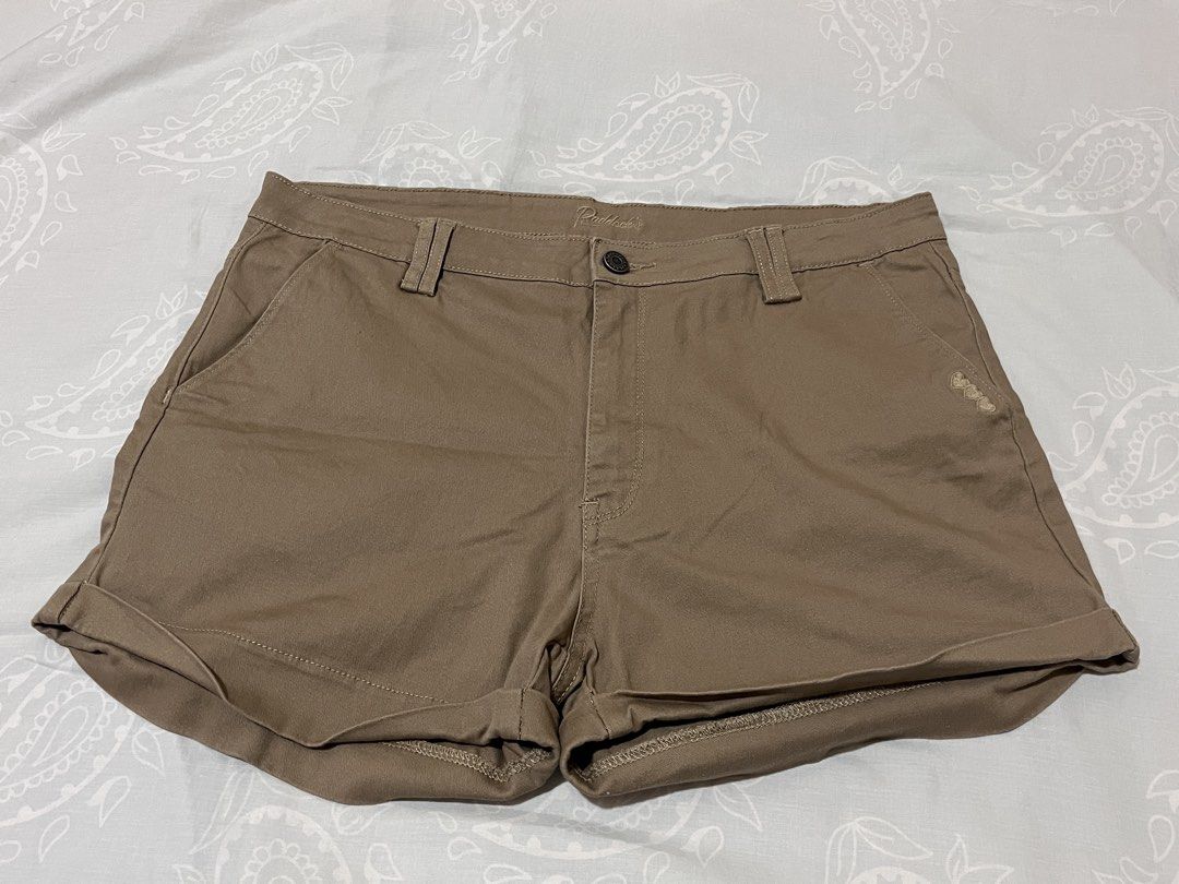 Paddock's Brown Casual Shorts Size 34 (Category: Shorts) located in Koronadal. Submitted by declutterprelovednitine_ey (Listing ID 1467627309, Image 1). Description: - Brand: Paddock's - Size: 34 - Color: Brown - Closure: Button and zipper fly - Design: Cuffed hem with subtle embroidered heart detail near the front left pocket - Pockets: Two front pockets and two back pockets with a branded metal tag - Condition/Quality: Clean stitching and durab