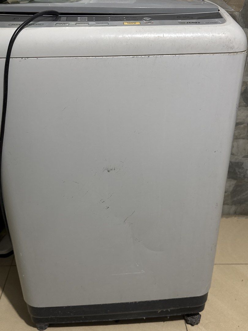 Panasonic 6.2kg Top Load Washing Machine (Category: Washing Machines and Dryers) located in Manila. Submitted by acluttering (Listing ID 1467765655, Image 2). Description: Panasonic washing machine, 6.2kg capacity. Fuzzy logic control panel with multiple wash programs including normal, speedy, delicate, and tub hygiene. Grey and white body with some surface scratches and marks from regular use. Includes attached drain hose and power cord. Works f