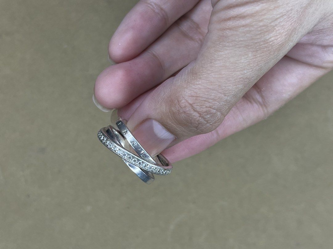 Pandora Interlocked Circles Pavé Ring Size 54 (Category: Rings) located in Bulacan. Submitted by vintagetreasureby.mivida (Listing ID 1467642304, Image 2). Description: - Authentic Pandora triple interlocked ring made of sterling silver - Features one band with sparkling clear pavé stones and two smooth bands - Stamped with PANDORA lettering and hallmarked S925 ALE 54 on the inside - Ring size: US 7 / UK N (measured on sizing mandrel) - Clean con