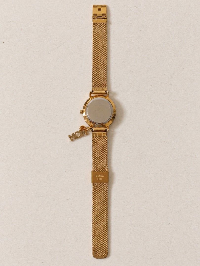 PARFOIS Gold Mesh Strap Watch with Charm (Category: Women's Watches) located in Manila. Submitted by maxinesotto (Listing ID 1467612657, Image 3). Description: Gold watch from Parfois, mesh strap style. Includes a small rhinestone charm hanging near the case. Back is stainless steel. Comes packed inside its original pink presentation box with price tag attached. Simple, clean minimalist face design in gold and white tones..
