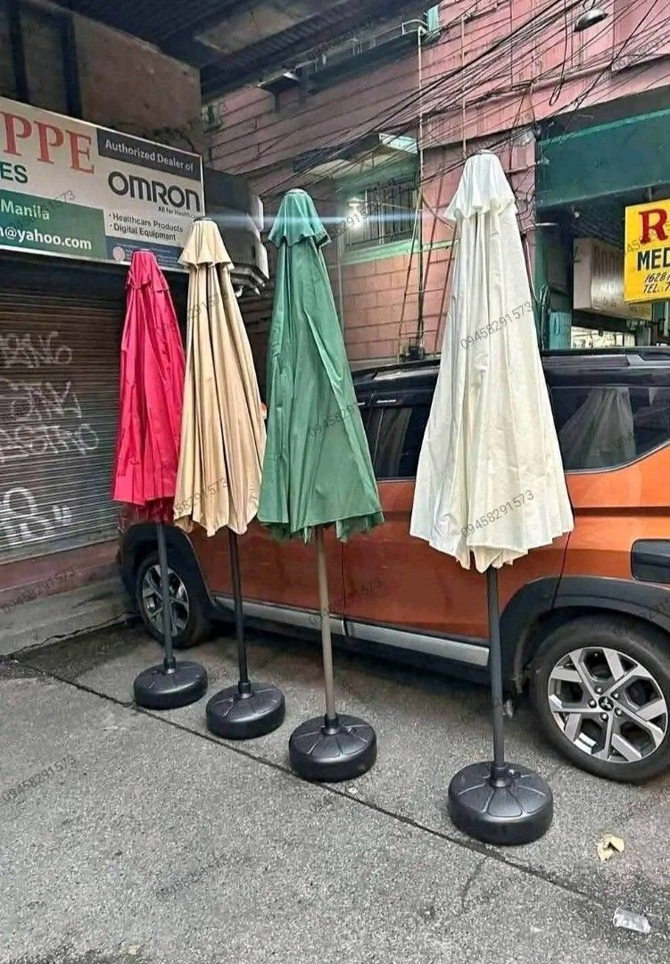 Patio umbrella (Category: Outdoor Furniture) located in Manila. Submitted by saguittarian06 (Listing ID 1467603926, Image 2). Description: BRANDNEW ❗️BRANDNEW ❗️ Patio Umbrella with Stand and base / Big Umbrella Details: * Ideal for gardens, beaches, patios or any outdoor locations * High quality material, durable and stable * Foldable, easy to set up * Adjustable pole length Colors available: * Green * Khaki * Red * White * Coffee brown COD VIA 