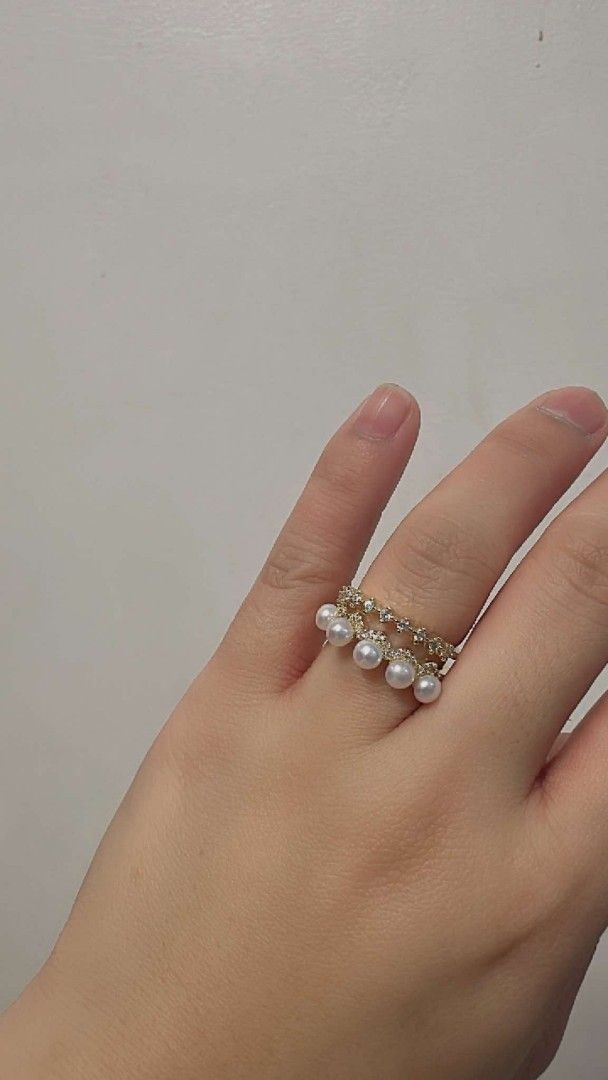 Pearl and crystal ring set gold and silver tones (Category: Rings) located in Manila. Submitted by princessfarrah_30 (Listing ID 1467786771, Image 3). Description: - Variety of stunning pearl rings for stackable everyday wear or special occasions - Features multi-pearl bands with sparkling rhinestone accents and single large statement pearls - Available in eye-catching peach and purple pearl tones - Offered in both versatile silver and gold band 