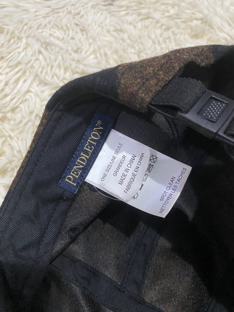 Pendleton Buffalo Check Camp Cap Brown Black Wool (Category: Caps & Hats) located in Antipolo. Submitted by switchneighborhood (Listing ID 1467739046, Image 3). Description: - Brand: Pendleton - Style: 5-panel camp cap - Pattern: Brown and black buffalo check - Material: Warm, sturdy wool - Closure: Adjustable strapback with plastic buckle - Size: One size fits most - Condition/Care: Great streetwear piece, spot clean only.