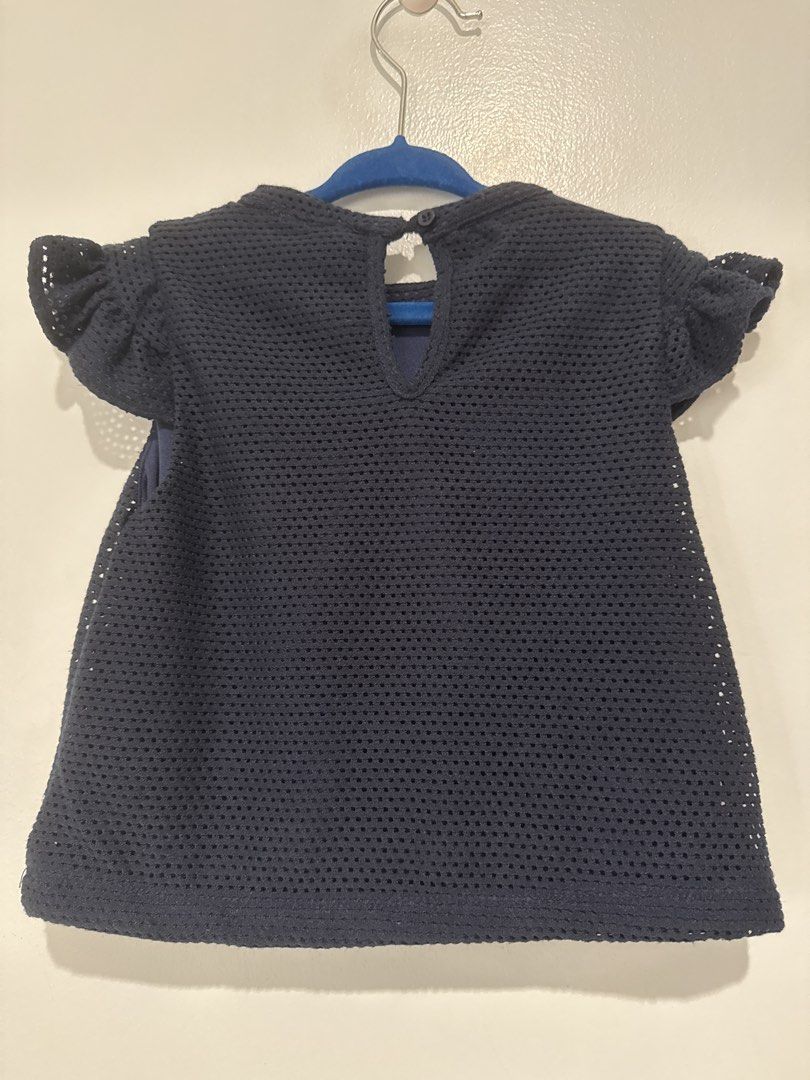 Peppermint Navy Blue Floral Applique Top Size 4 (Category: Babies & Kids Fashion) located in Manila. Submitted by hopesanddreams_closet (Listing ID 1467680220, Image 2). Description: - Brand: Peppermint - Size: Kids 4 - Color: Dark navy blue with red rosettes and gold butterfly applique - Material: Textured mesh fabric with solid blue lining - Design: Short flutter sleeves and back keyhole button closure - Condition: Worn a few times, washed, and