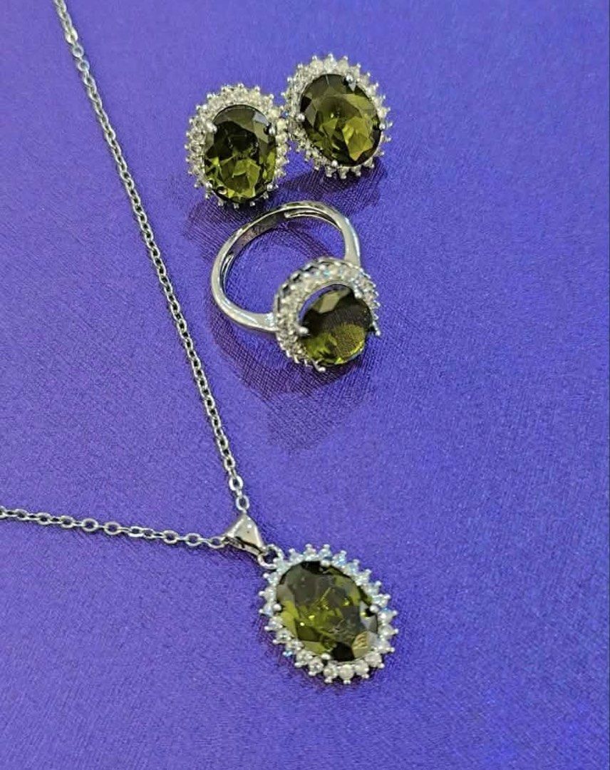 Peridot Necklace Earrings and Ring Set (Category: Necklaces) located in Mandaue City. Submitted by chuchi152615 (Listing ID 1467768461, Image 1). Description: - Complete matching set: necklace with pendant, earrings, and ring - Stunning oval-cut olive green main stones - Sparkling pave crystal halos around every stone - Elegant silver-toned metal finish - Perfect for gifting, events, or everyday glam - Send a message to order or inquire!.