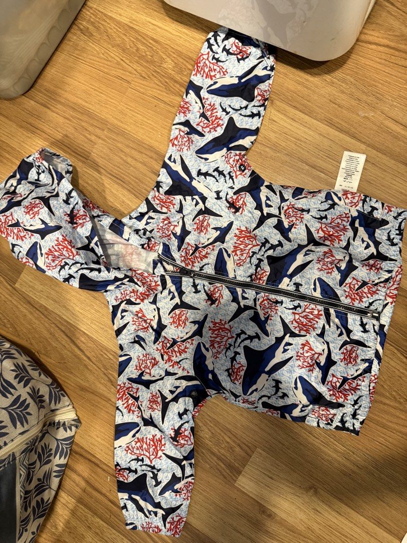 Petit Bateau Shark Print Hooded Jacket 12M (Category: Babies & Kids Fashion) located in Makati City. Submitted by rockandraw (Listing ID 1467756091, Image 2). Description: - Brand: Petit Bateau - Size: 12M / 74cm - Design: All-over shark and coral print in blue, red, and white - Features: Hooded, full front zipper closure, lightweight material - Origin: Made in India - Condition: Clean inside and out, excellent ready-to-wear condition.