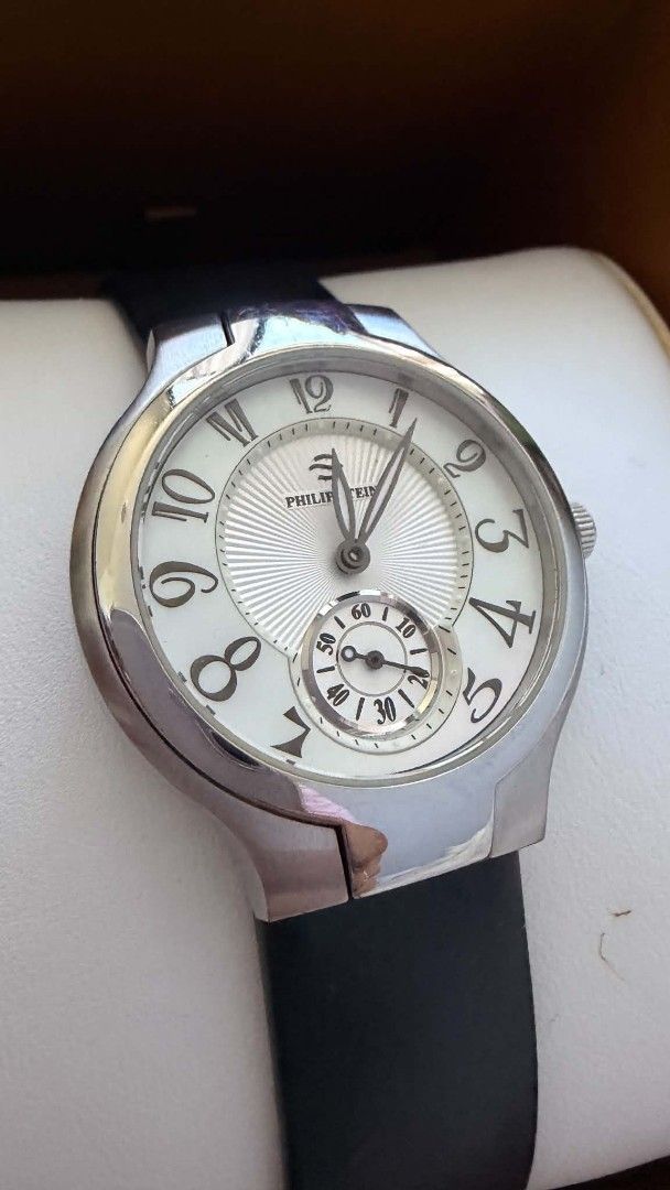 Philip Stein round wristwatch with black leather strap (Category: Women's Watches) located in Manila. Submitted by whemc (Listing ID 1467626413, Image 1). Description: - Brand: Philip Stein - Case: Silver-toned stainless steel - Strap: Classic black leather with standard pin buckle - Dial: White textured dial with large Arabic numerals - Features: Small seconds sub-dial at the bottom, manual winding crown - Style: Clean lines, minimalist design, 