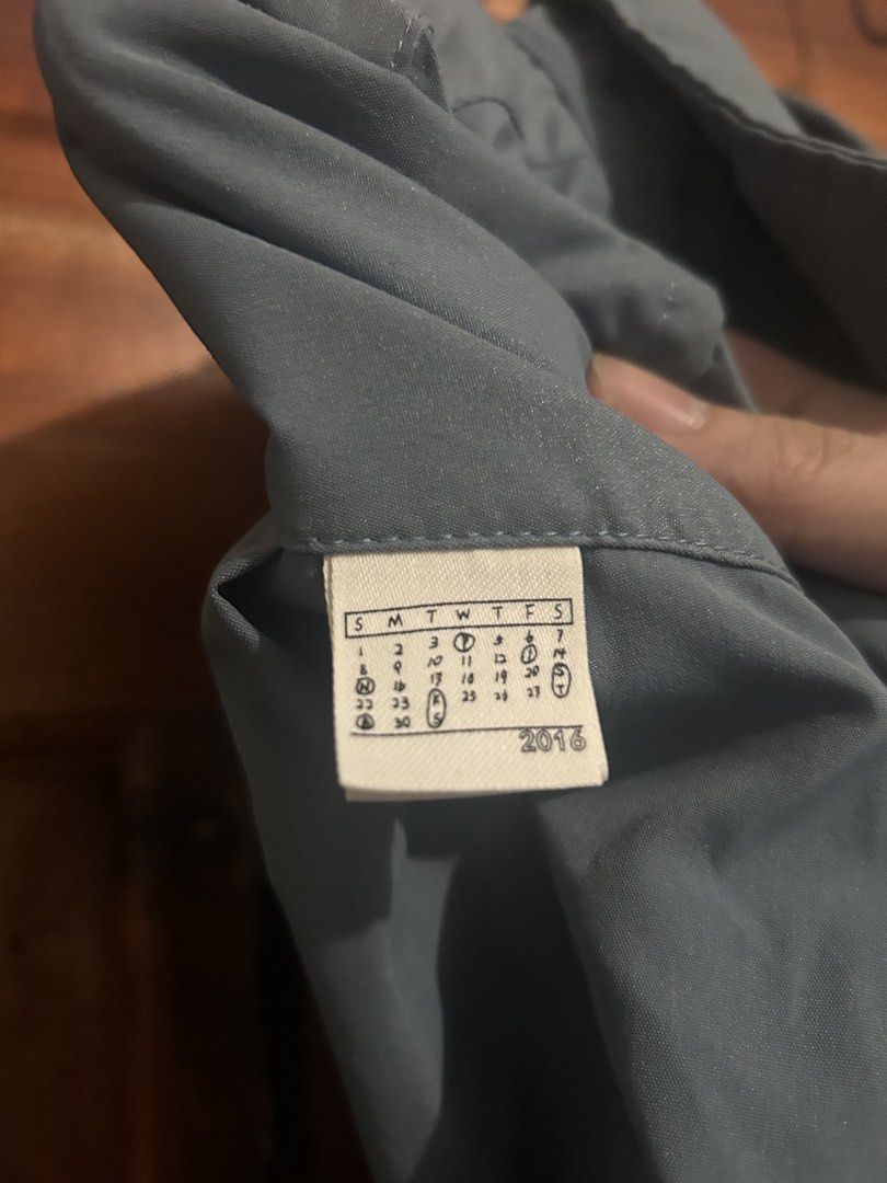 PIN SKTBS Blue Button Up Shirt Size S (Category: Tshirts & Polo Shirts ) located in Lucena. Submitted by cityboyfits (Listing ID 1467837528, Image 3). Description: - Brand/Model: PIN SKTBS Button-Up Shirt - Color: Slate Blue - Size: Small - Dimes: 29x27 - Material: 100% Cotton - Details: Long sleeves, front button closure, classic collar, two large chest pockets, clean inside tag with calendar graphic - Condition/Style: Solid basic piece, great f