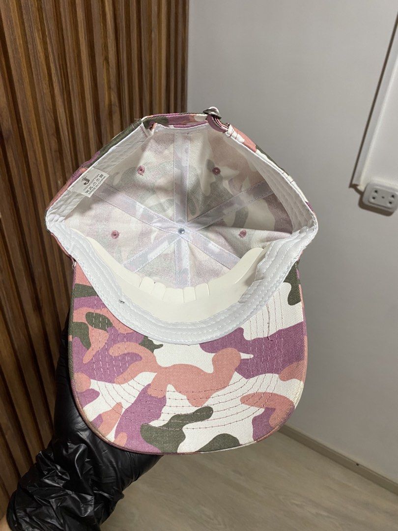 Pink Camo God's Favorite Baseball Cap (Category: Caps & Hats) located in Caloocan City. Submitted by heatedcaps4425 (Listing ID 1467802034, Image 3). Description: Pink camouflage baseball cap with embroidered lettering across the front reading God's Favorite. Adjustable strapback closure in the back. Interior shows 100 percent cotton tag and clean white sweatband lining. Unstructured low profile fit. Great streetwear accessory..