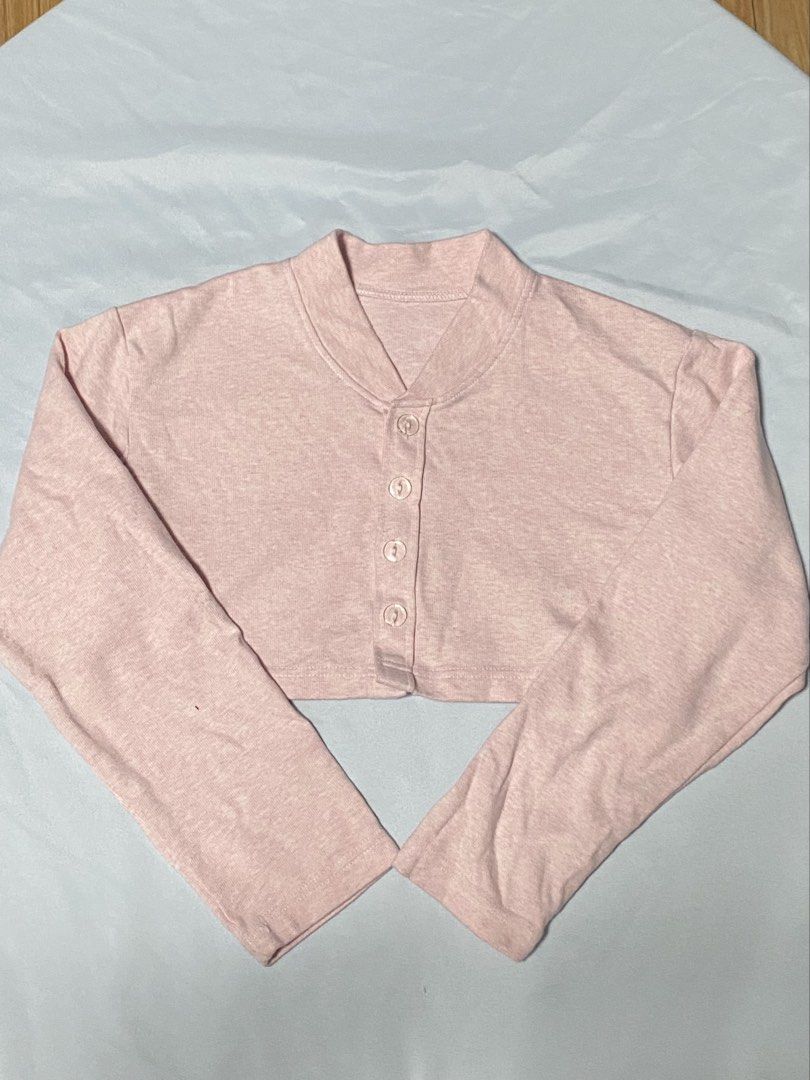 Pink cropped cardigan button-up top (Category: Longsleeves) located in Paranaque City. Submitted by pomeloluvr (Listing ID 1467677447, Image 1). Description: - Color: Pink - Size: Medium - Material: 95% cotton, 5% spandex (soft and stretchy) - Design: Long sleeves, front button closure, cropped length .