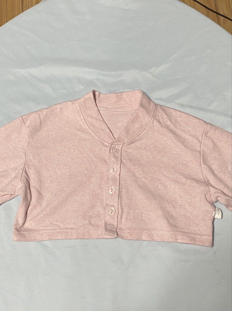 Pink cropped cardigan button-up top (Category: Longsleeves) located in Paranaque City. Submitted by pomeloluvr (Listing ID 1467677447, Image 2). Description: - Color: Pink - Size: Medium - Material: 95% cotton, 5% spandex (soft and stretchy) - Design: Long sleeves, front button closure, cropped length .