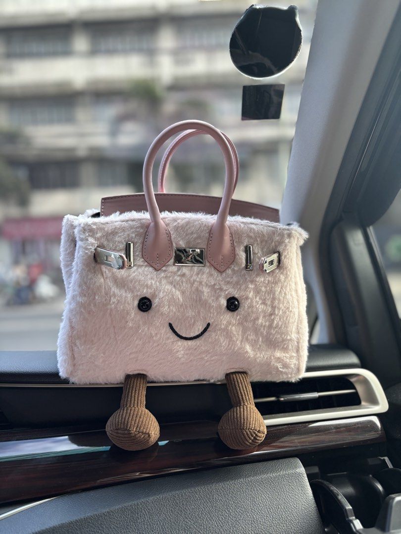 Pink JellyBirkin 25cm (Category: Shoulder Bags) located in Manila. Submitted by curtsysprettythings (Listing ID 1467605341, Image 2). Description: - Style: Quirky Birkin-inspired furry handbag - Color/Material: Soft pink faux fur with pink leather flap, handles, and silver hardware - Size: Medium (~25cm) - Unique Features: Brown dangling legs, black embroidered eyes, smiling mouth, and an attached bunny keychain charm - Condition: Brand new and s