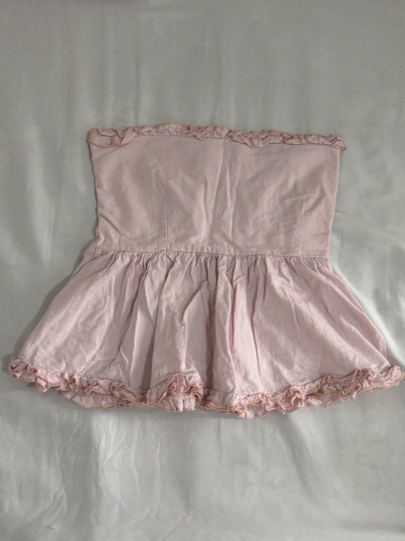Pink Ruffled Tube Top (Category: Sleeveless) located in Quezon City. Submitted by chrissie__ (Listing ID 1467689474, Image 1). Description: ▪️Well-used.