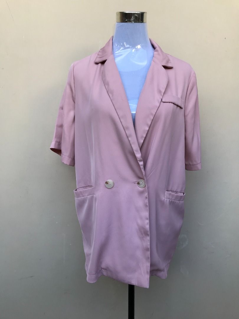 Pink short sleeve blazer jacket with buttons (Category: Coats, Jackets and Outerwear) located in Quezon City. Submitted by ezrakeith (Listing ID 1467806576, Image 2). Description: - Color: Dusty pink - Style: Short sleeves, lapel collar, front button closure - Pockets: Two lower front pockets, one chest pocket - Fit: Relaxed, lightweight fabric - Versatile: Ideal for office wear and smart casual layering.