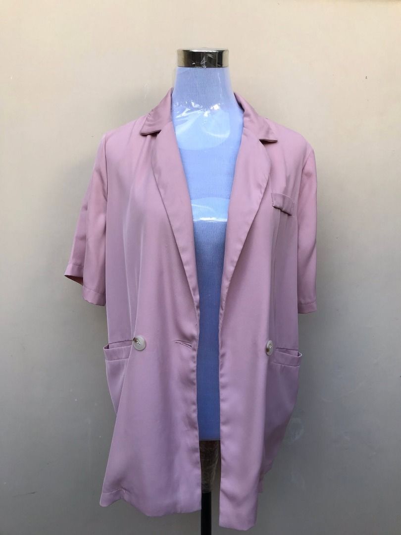 Pink short sleeve blazer jacket with buttons (Category: Coats, Jackets and Outerwear) located in Quezon City. Submitted by ezrakeith (Listing ID 1467806576, Image 1). Description: - Color: Dusty pink - Style: Short sleeves, lapel collar, front button closure - Pockets: Two lower front pockets, one chest pocket - Fit: Relaxed, lightweight fabric - Versatile: Ideal for office wear and smart casual layering.