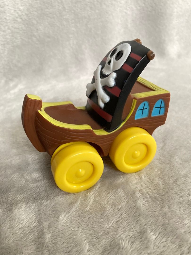 Pirate Ship Toy Vehicle (Category: Kids Toys) located in Rizal. Submitted by sheeraay (Listing ID 1467703309, Image 1). Description: - Fun pirate-themed toy car with a realistic wood-plank molded brown body - Features eye-catching big yellow wheels and blue side window graphics - Equipped with a cool sail featuring a classic red, black, and white skull-and-crossbones design - Rolls smoothly on hard surfaces for endless playtime adventures - Perfe