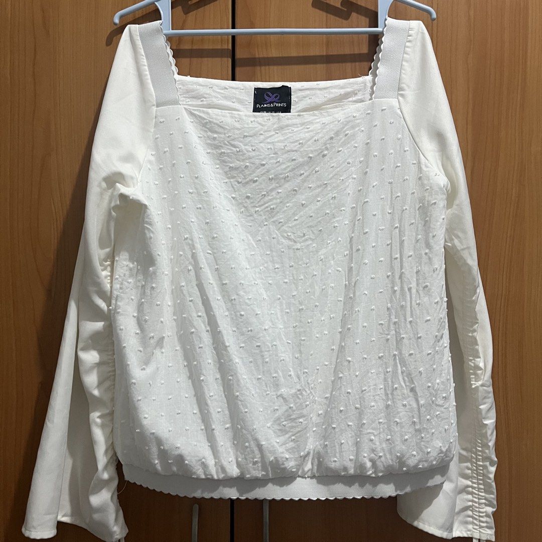 Plains & Prints White Long Sleeve Blouse Size M (Category: Longsleeves) located in Makati City. Submitted by possession.ph (Listing ID 1467782743, Image 1). Description: - Brand: Plains & Prints - Color: White - Size: PH M / UK 10 / US 6 - Design: Square neckline, textured dots, and scalloped hem details - Sleeves: Ruched with adjustable drawstrings - Minor Flaw: Has yellowing stains on the sleeves. Please see last picture. .