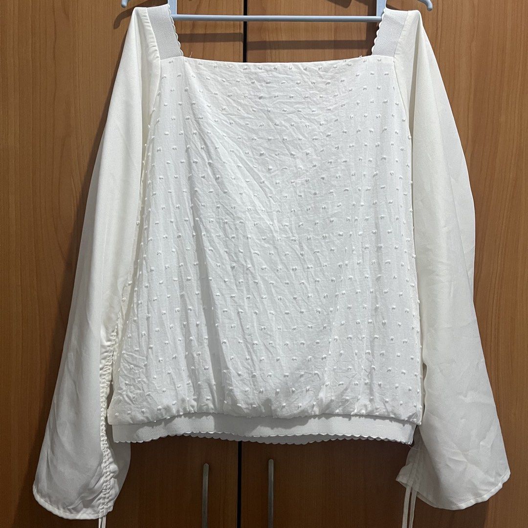 Plains & Prints White Long Sleeve Blouse Size M (Category: Longsleeves) located in Makati City. Submitted by possession.ph (Listing ID 1467782743, Image 3). Description: - Brand: Plains & Prints - Color: White - Size: PH M / UK 10 / US 6 - Design: Square neckline, textured dots, and scalloped hem details - Sleeves: Ruched with adjustable drawstrings - Minor Flaw: Has yellowing stains on the sleeves. Please see last picture. .