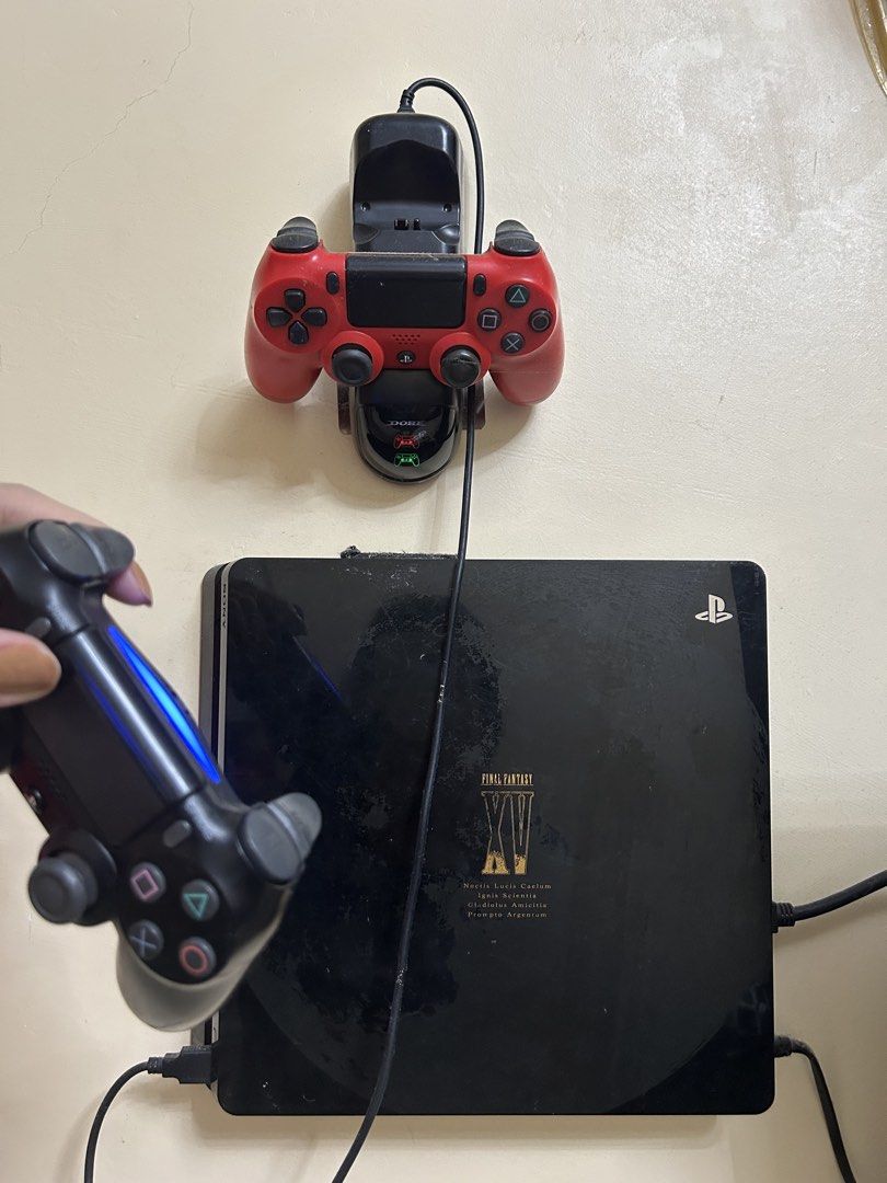PlayStation 4 Console with 2 Controllers and Games Bundle (Category: PlayStation) located in Valenzuela. Submitted by jenny_dclls (Listing ID 1467654895, Image 1). Description: -1 TB - PlayStation 4 Console with Limited Edition Final Fantasy XV design - 2 DualShock 4 Controllers (Black and Red colors) - Dual Controller Charging Dock included - Physical Games: The Witcher 3 Wild Hunt, Horizon Zero Dawn, God of War, Assassin's Creed IV Black Flag, 