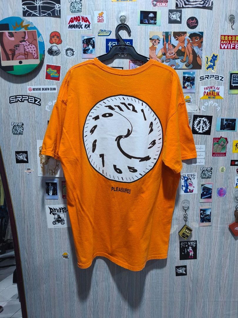 ​Pleasures "Time" Tee (Category: Tshirts & Polo Shirts ) located in Davao. Submitted by thethriftproject082 (Listing ID 1467794749, Image 1). Description: ​Pleasures "Time" Tee 📍𝐌𝐈𝐍𝐄: 450 📍𝐒𝐈𝐙𝐄 𝐎𝐍 𝐓𝐀𝐆: 2XL 📍𝐃𝐈𝐌𝐄𝐒: 24 x 30 - Brand: Pleasures - Color: Bright Orange - Condition: Clean overall - Material: Cotton - Design: Front chest text ("Music is changing...") and large distorted clock graphic on the back - Fit/Style: Short sl