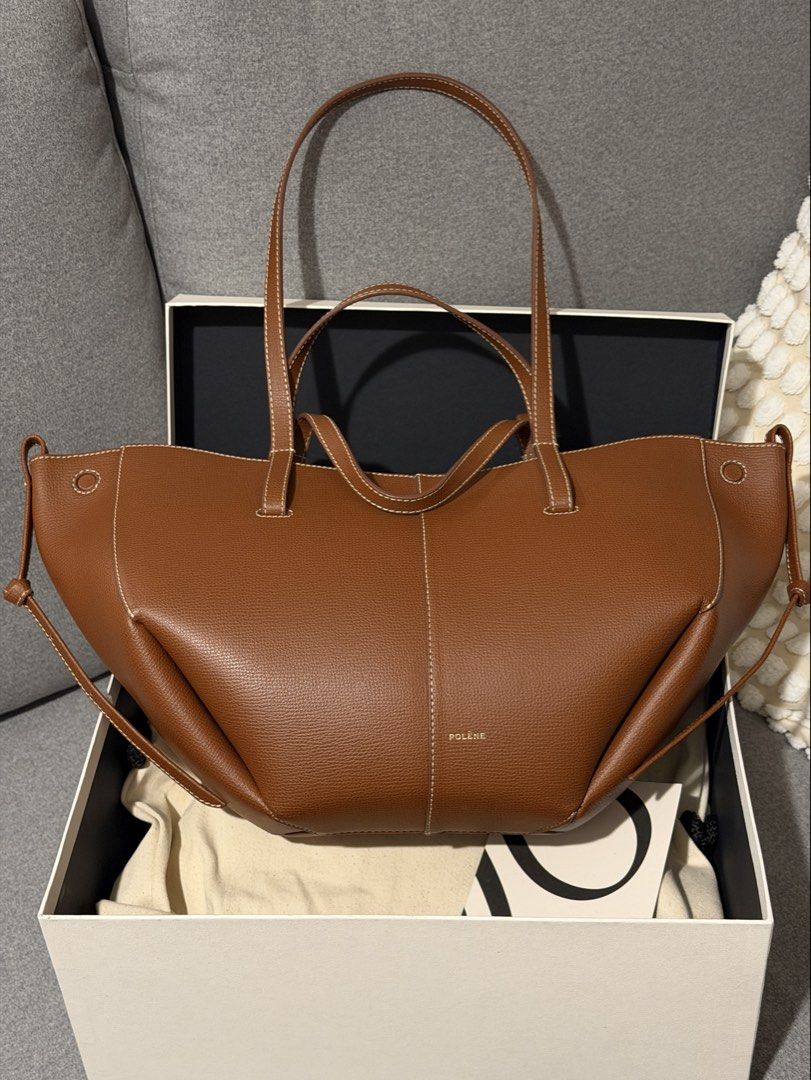 Polene Cyme Mini - Textured Cognac (Category: Tote Bags) located in Taguig. Submitted by reneemacaraeg (Listing ID 1467726963, Image 1). Description: - Brand: Polène Cyme Mini Tote - Material: Textured tan leather with contrast white stitching - Features: Structured panels, dual handle lengths, clean interior that fits a laptop easily - Inclusions: Original dust bag and box included - Bought from Paris, ORIGINAL of course. I can even send the pho
